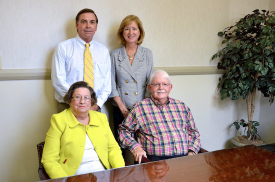 Adelia “Dee” Moore Smith (front, left), Reed Moore (front, right), Henry G. Moore III (back, left)  and Nancy Moore (back, right)