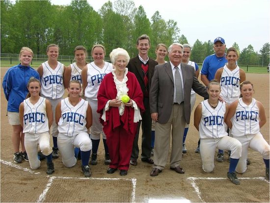 Tim Martin (center) and parents Fred and Lowanda Martin with the PHCC softball team on Martin Field