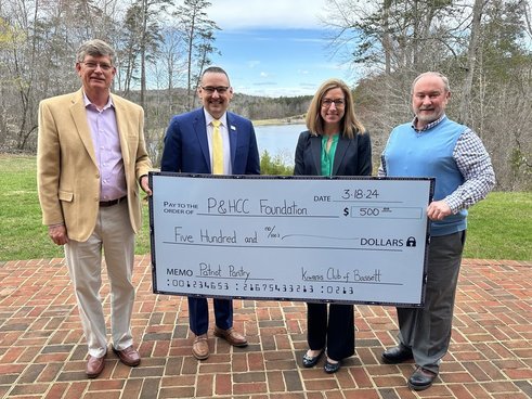 In the photo: P&HCC President Dr. Greg Hodges and P&HCC Foundation Executive Director Tiffani Underwood accept a donation to support Patriot Pantry from Stu Warren (L) and Tim Stone (R) of Bassett Kiwanis Club.