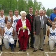 Tim Martin, his parents, and the PHCC softball team